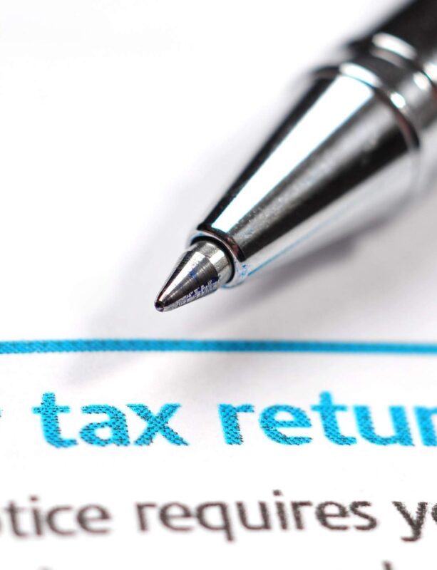 Clients and professional accountants collaborating on tax returns, representing Apex Flow Accountancy's seamless financial services in the UK.
